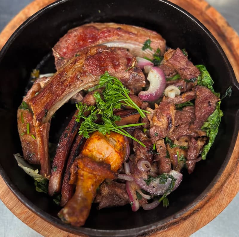 Grilled meat served in a skillet